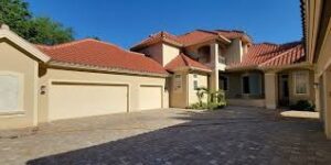 House and driveway after pressure washing