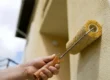 Using a roller to paint stucco